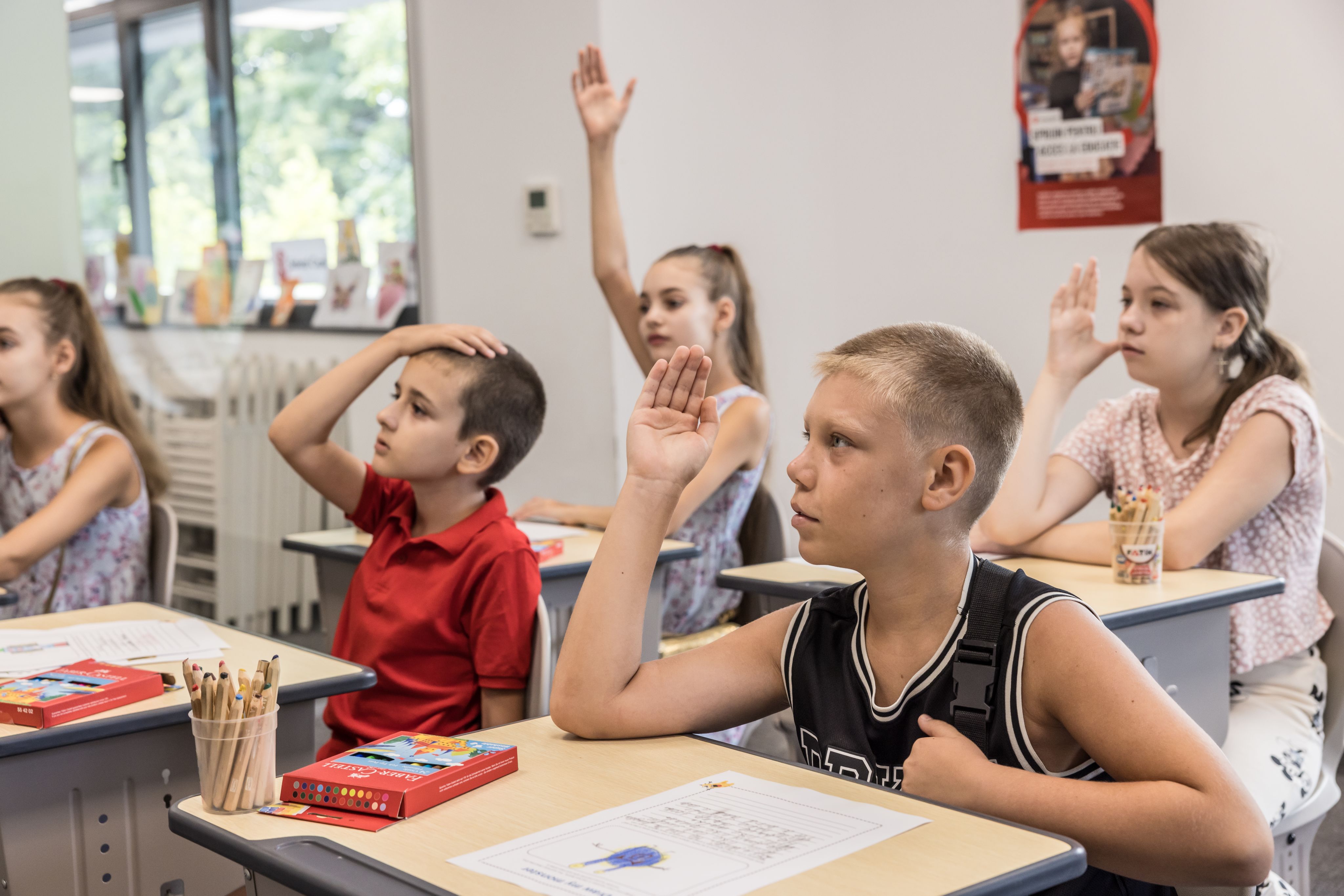 Children from Ukraine take part in English lessons at Save the Children's hub, Bucharest, Romania