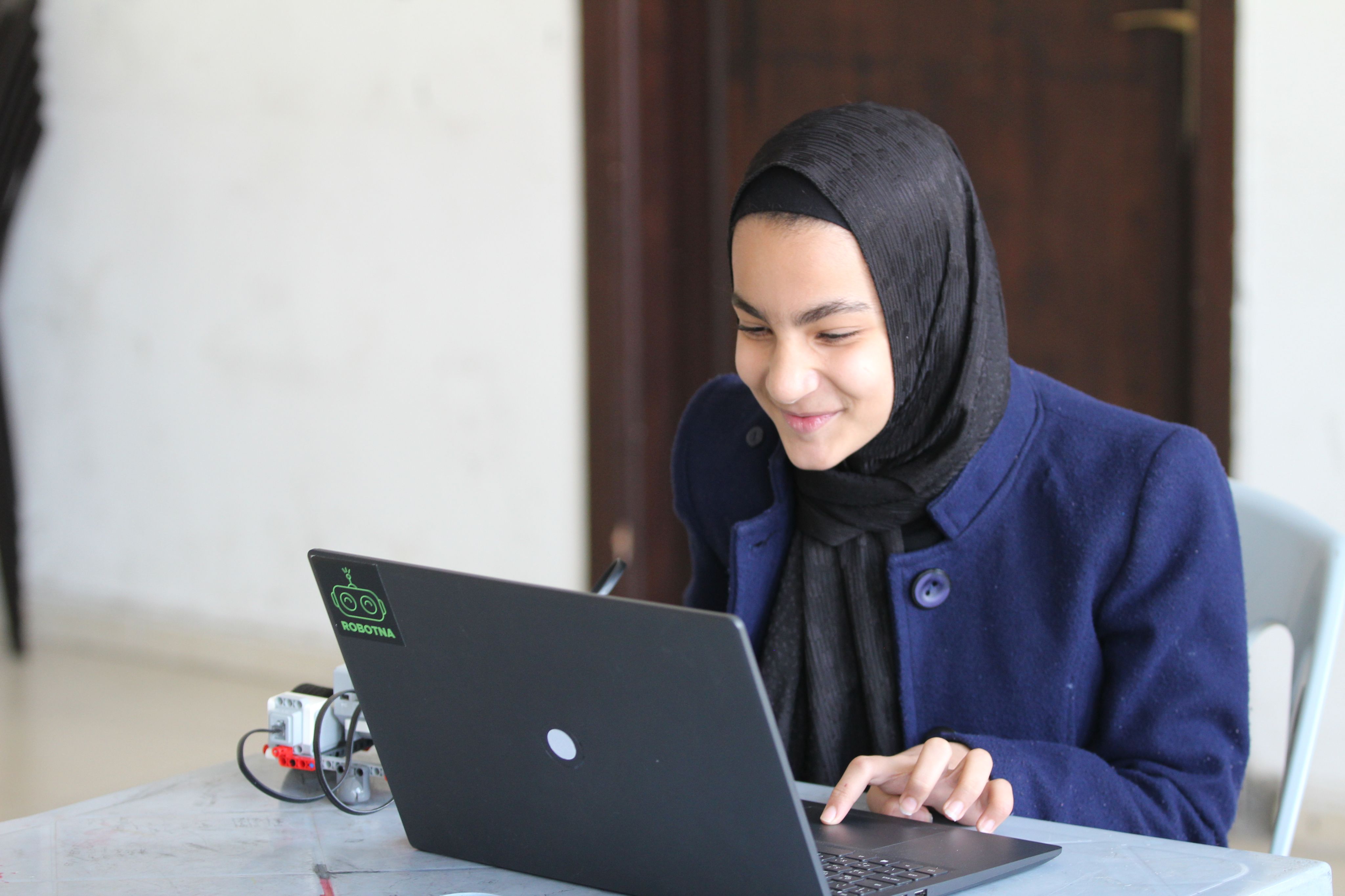 Young girl interacting with a computer
