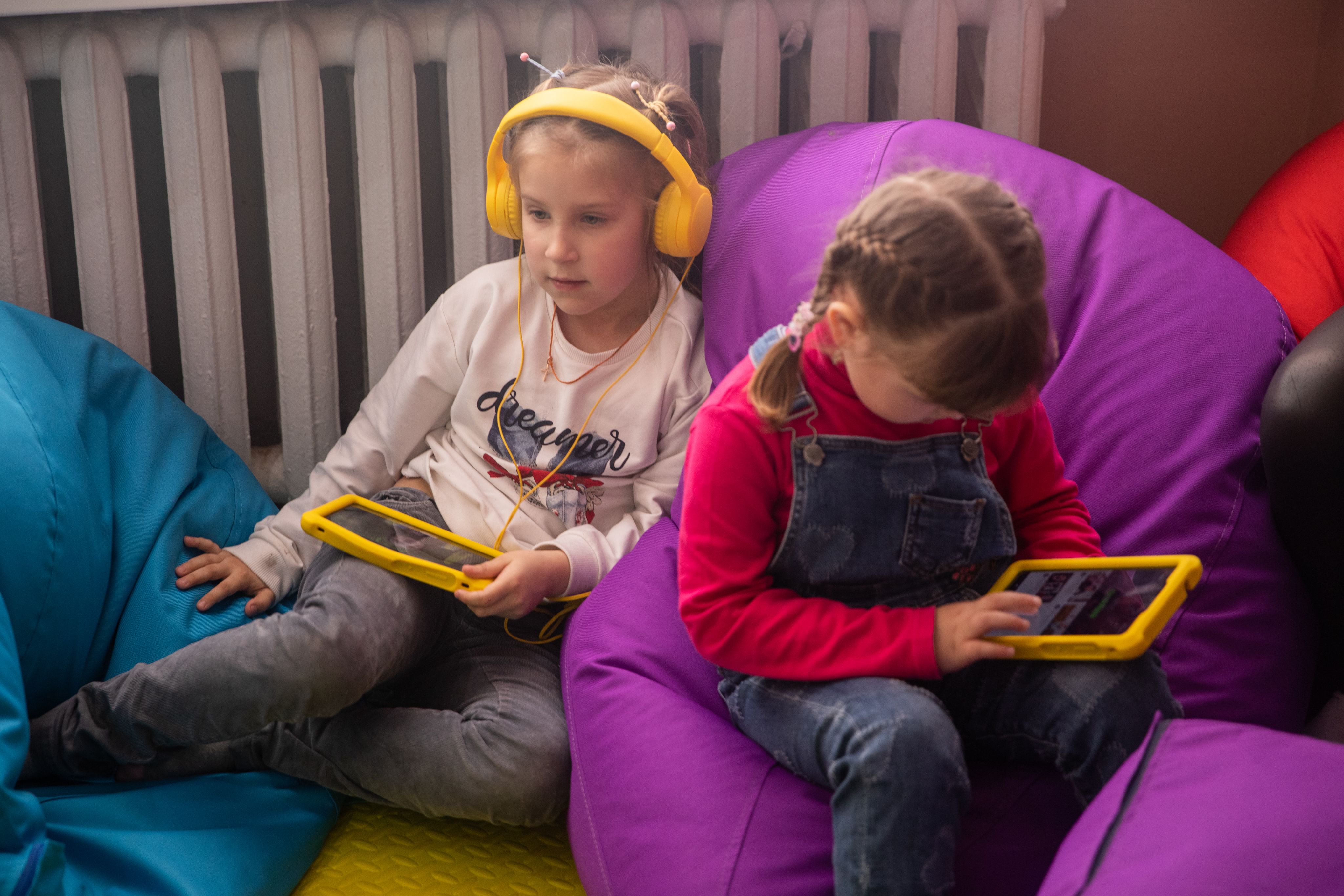 Young girls watching ipads